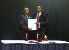 MEDI Chair, Mr. Jonathan White, receiving governor's proclamation from GOME Director, Mr. Delquan Dorsey.